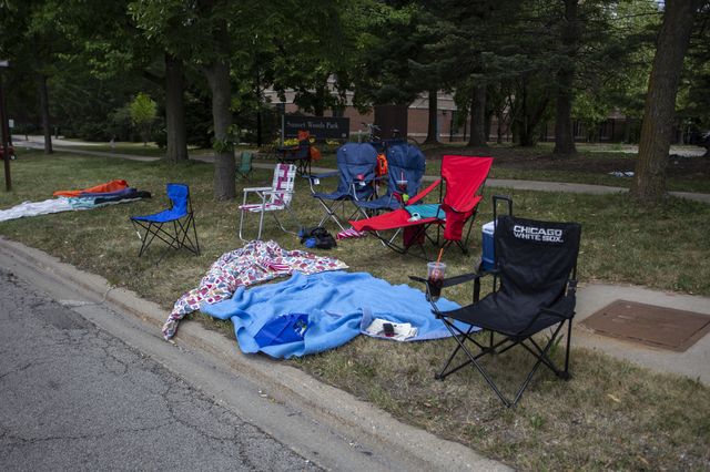 Chairs and blankets are left abandoned after a shooting at a Fourth of July parade in Illinois.